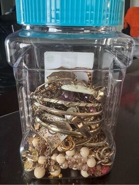 Mixed Gold-Tone jar with Bracelets and Necklaces and rings